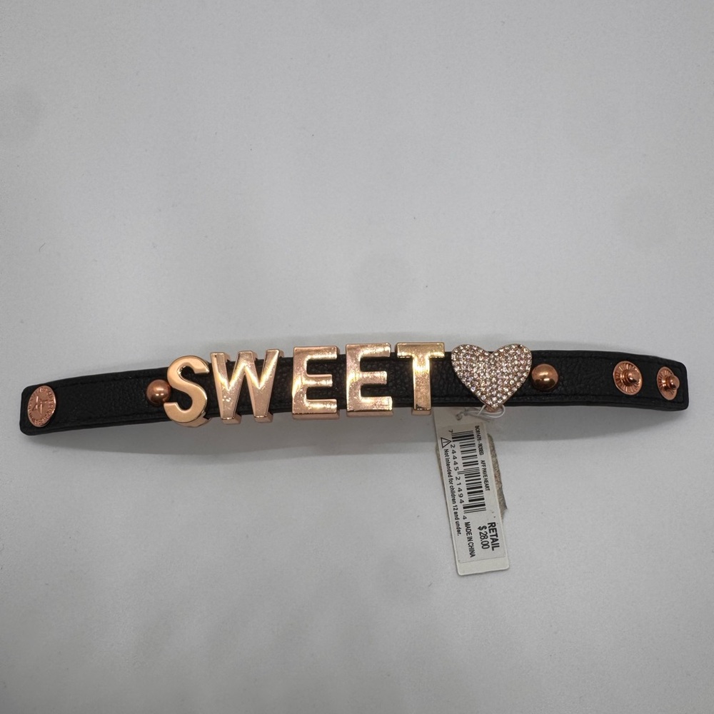 NWT BCBGeneration black faux leather cuff bracelet with rose gold-tone "SWEET”